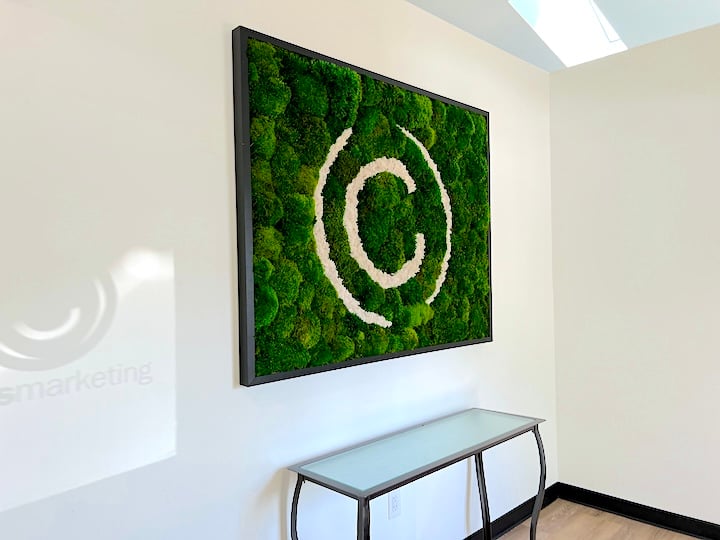 Coles Marketing moss art with "C" logo