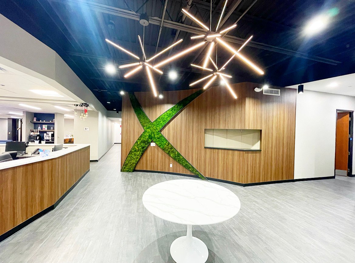 Moss Wall in the shape of an "x" in Axon's lobby